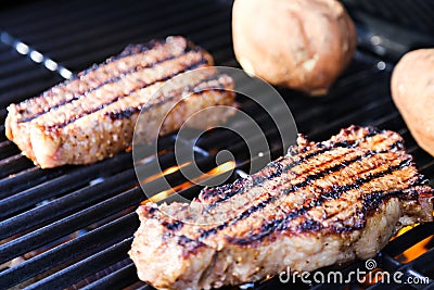 Steaks on grill Stock Photo