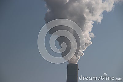 Steam comes out the chimney of the coal power plant of Uniper in the Rotterdam Maasvlakte harbor in The Netherlands Editorial Stock Photo
