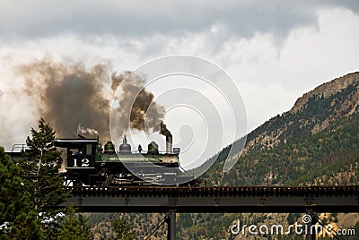 Steam Engine on a Mountain Bridge Stock Photo