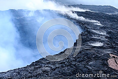 Steam, gases and sulfuric acid rise from Kilauea caldera Stock Photo