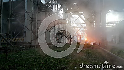 Steam leak in industial behind sunset background Stock Photo