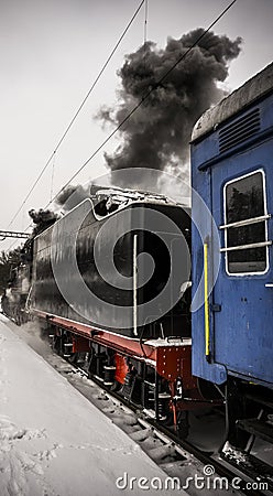 Steam locomotive with blue car Stock Photo