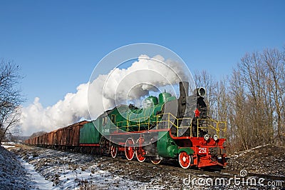 Steam locomotive with freight cars. Editorial Stock Photo