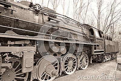 Steam locomotive in retro look, parked on a terminal station. Historical railroad Stock Photo