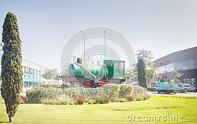 Steam locomotive of the 19th century as a memorial on the square Editorial Stock Photo