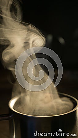 Steam over a cup of coffee Stock Photo