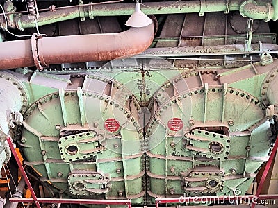 Steam pipes and condenser in a power plant Stock Photo