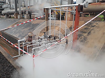 Steam pipes leakage with barricade tape,danger area , Stock Photo