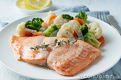 Steam salmon and vegetables, Paleo, keto, fodmap, dash diet. Mediterranean food with fish Stock Photo