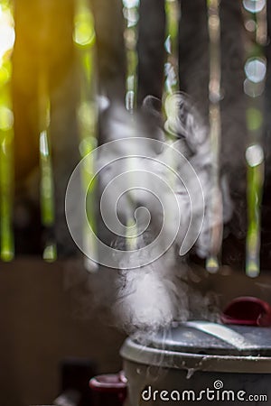 Steam smoke of the old electric rice cooker Stock Photo