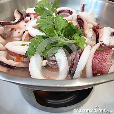 Steam squid with spicy chilli and lemon sauce. Stock Photo