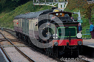 Steam train, driver & passengers. Blue Bell Railway Line, Sussex, UK Editorial Stock Photo