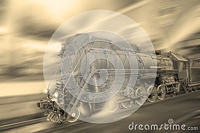 Steam train goes fast on the night station background. Stock Photo