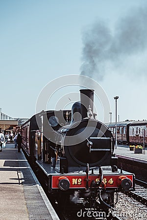 Steam train on the platform at Sheringham station, Norfolk, UK Editorial Stock Photo