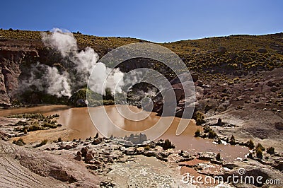 Steam venting from mud pools in Atacama desert Stock Photo
