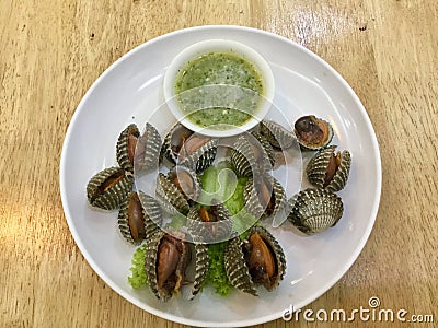 Steamed Blood cockles with Thai green spicy sauce Stock Photo