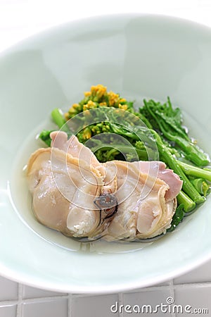 Steamed clams and field mustard in rice wine Stock Photo