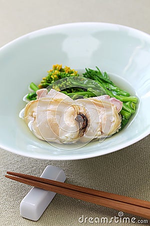 Steamed clams and field mustard in rice wine Stock Photo