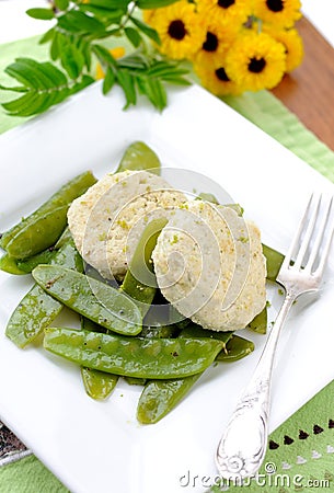 Steamed cutlets and pea pods Stock Photo