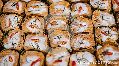 Steamed fish in banana leaf containers made for sale in the traditional Chinese market of Ban Chak Ngaew Stock Photo