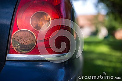 Steamed tail light on Toyota Avensis car in soft focus Editorial Stock Photo