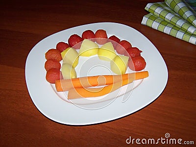 Steamed vegetables - diet food for digestive problems - vegetables arranged on a white plate in the shape of a solar half shell Stock Photo