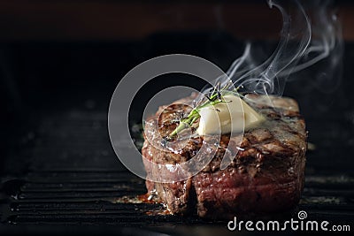 A steaming beef tenderloin steak is grilled Stock Photo