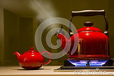 Boiling red kettle with red teapot Stock Photo