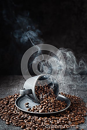 Steaming coffee beans in a cup Stock Photo