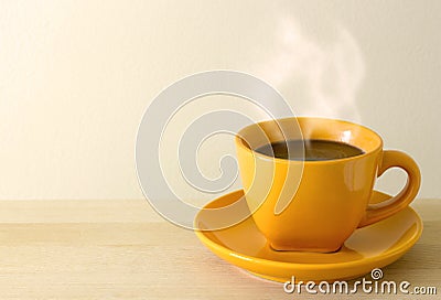 Steaming coffee cup on table Stock Photo