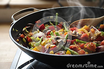 steaming mixed vegetables in the wok, asian style cooking vegetarian and healthy Stock Photo