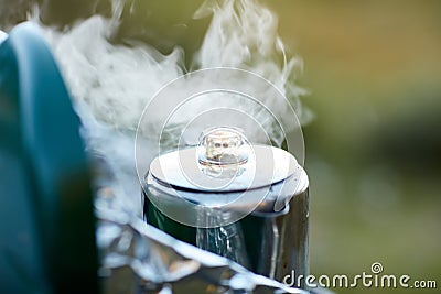 Steaming stainless steal coffee pot on a burner Stock Photo