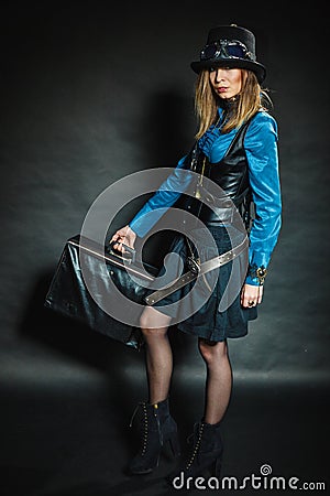 Steampunk girl with retro bag. Stock Photo