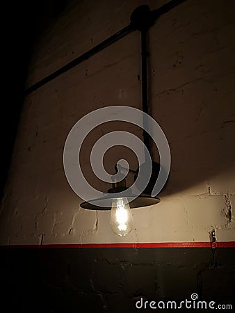 Retro-style lamps hanging on the wall Stock Photo