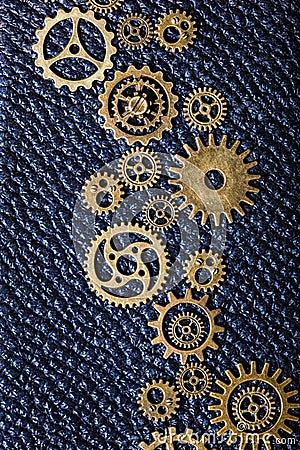 Steampunk mechanical cogs gears wheels on leather background Stock Photo