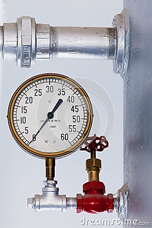 Steampunk metal pressure gauge on boiler tank Stock Photo