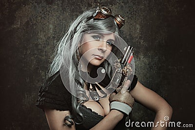 Steampunk woman with mechanical gun Stock Photo