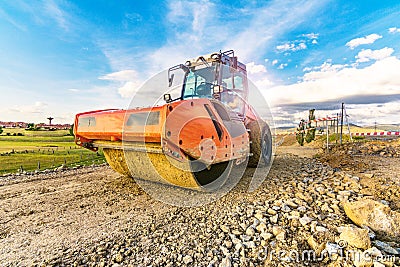 Steamroller performing road paving works Stock Photo