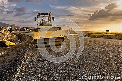 Steamroller performing road paving works Stock Photo