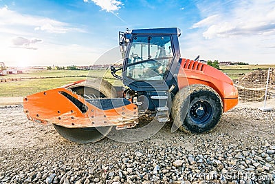 Steamroller performing road paving works Stock Photo