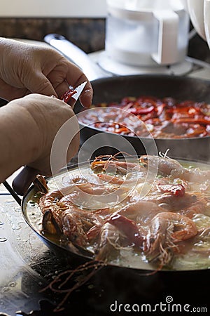 Steamy Homemade Paella Traditionally Cooked with Prawns and Shellfish Stock Photo