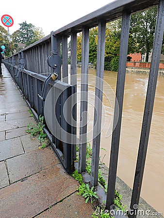 steel barriers installed on the bridge railing to prevent river overflow during flooding Stock Photo