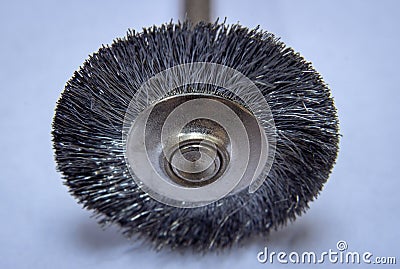 Steel brush used with rotary tools to clean metal surfaces Stock Photo