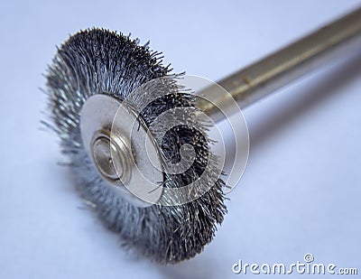 Steel brush used with rotary tools to clean metal surfaces Stock Photo