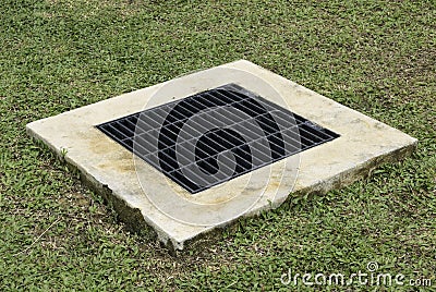 Steel closed drain cover in the garden Stock Photo