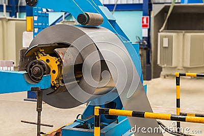 Steel coil on machine Stock Photo