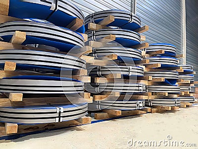 Steel coil stacked one on top of the other, raw material, cold stamping, metal working in automotive industry Stock Photo