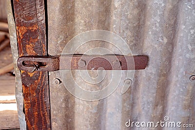 Vintage Door Lock On Old Iron Shed Stock Photo