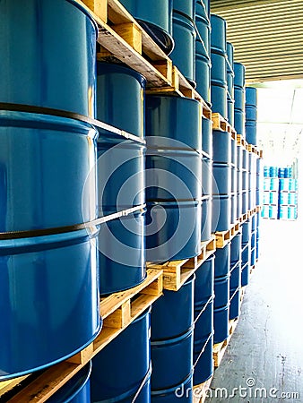 Steel drums stored in warehouse Stock Photo