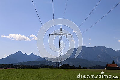 Steel electricity pylon on bright blue sky Stock Photo